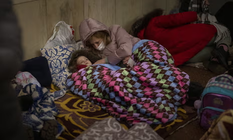 Children sleeping in underground shelter